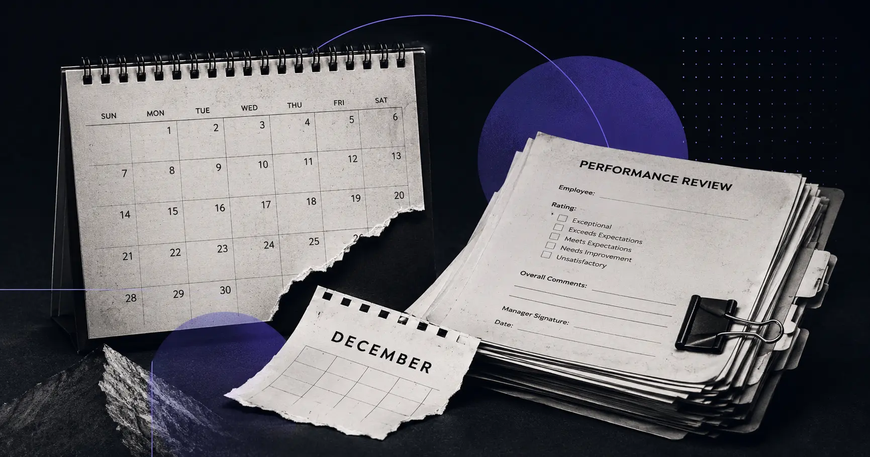 A wall calendar with the December page torn off, lying on a desk next to a stack of unsigned performance review forms